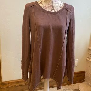 Like new shirt with v-cut bottom.